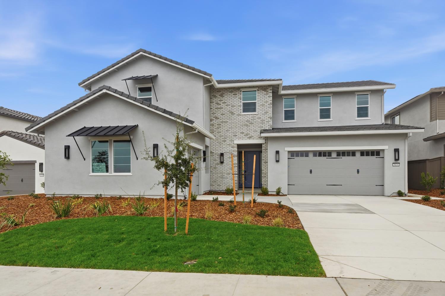 3034 Sidewinder Loop Rocklin, CA 95765 - Photo 6 of 37 a front view of a house with a yard