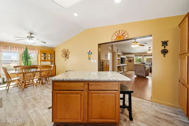 a kitchen with a table and chairs in it