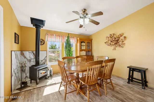 a view of a dining room with furniture and a chandelier
