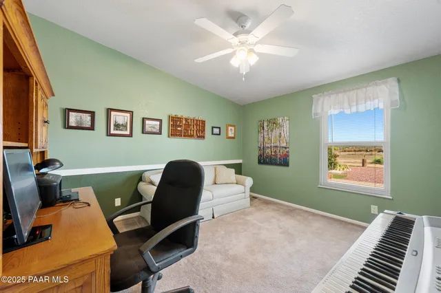 a workspace with furniture and a window