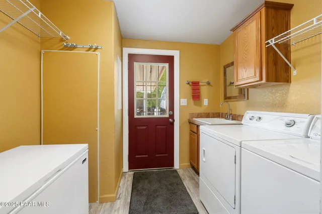 a utility room with dryer and washer
