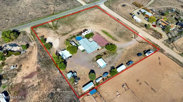 an aerial view of a house with a garden