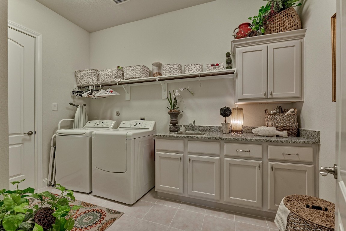 7430 Kearney Hill Lane Spring, TX 77389 - Photo 32 of 47 Utility room is spacious and also offers cabinetry for storage