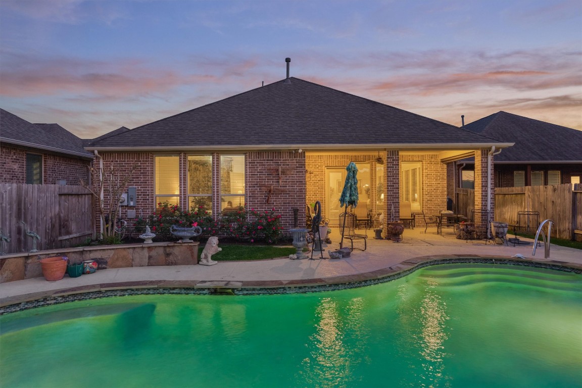 7430 Kearney Hill Lane Spring, TX 77389 - Photo 42 of 47 Beautiful sparkling pool awaits you. Home is brick all around with gutters in front and back