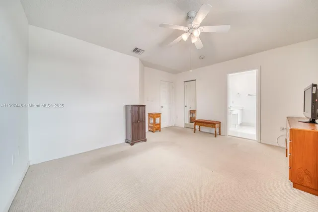 a view of a livingroom with a flat screen tv and furniture