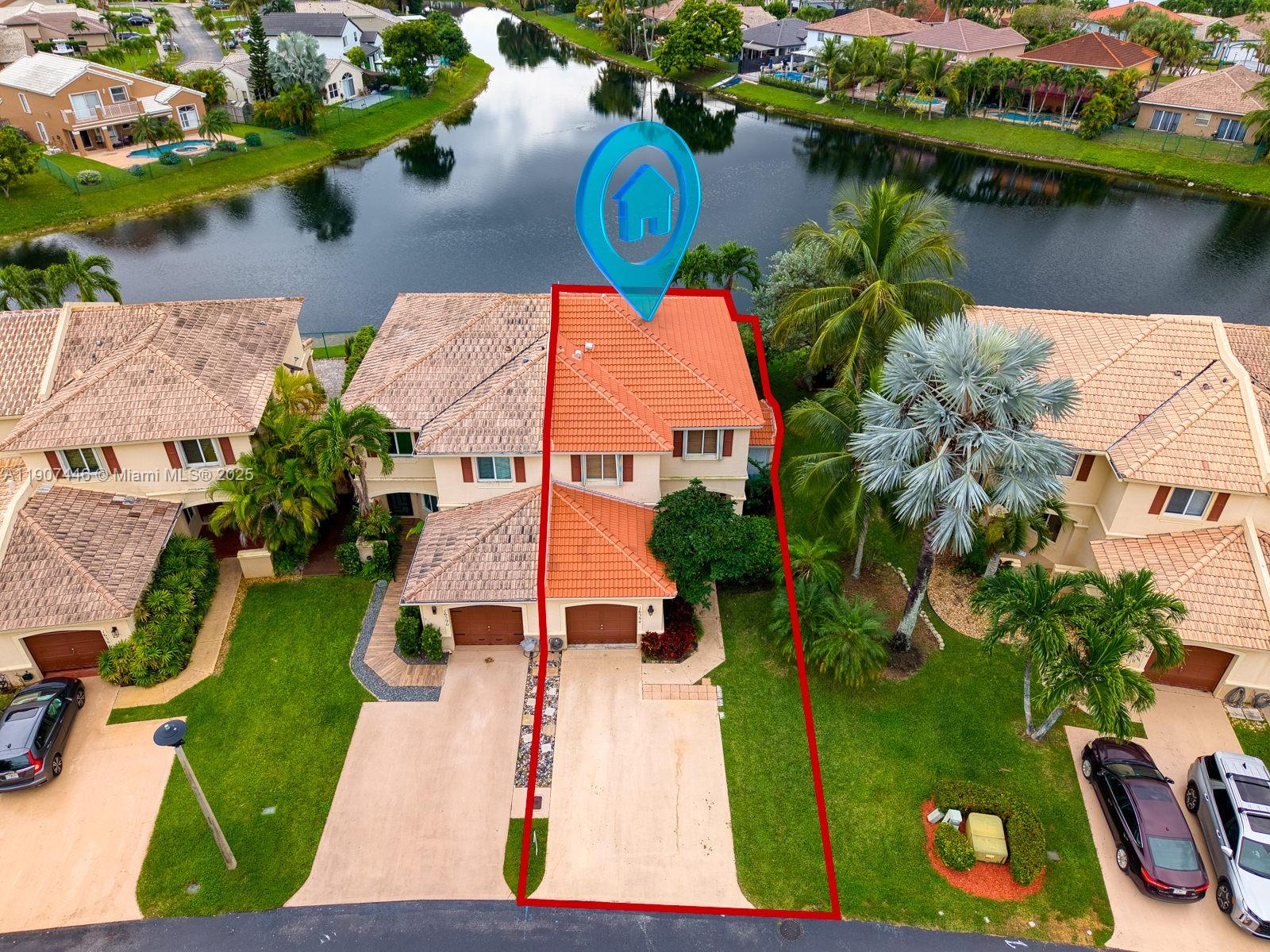 16394 Southwest 75th Street Miami, FL 33193 - Photo 3 of 35 an aerial view of a house with garden space and lake view