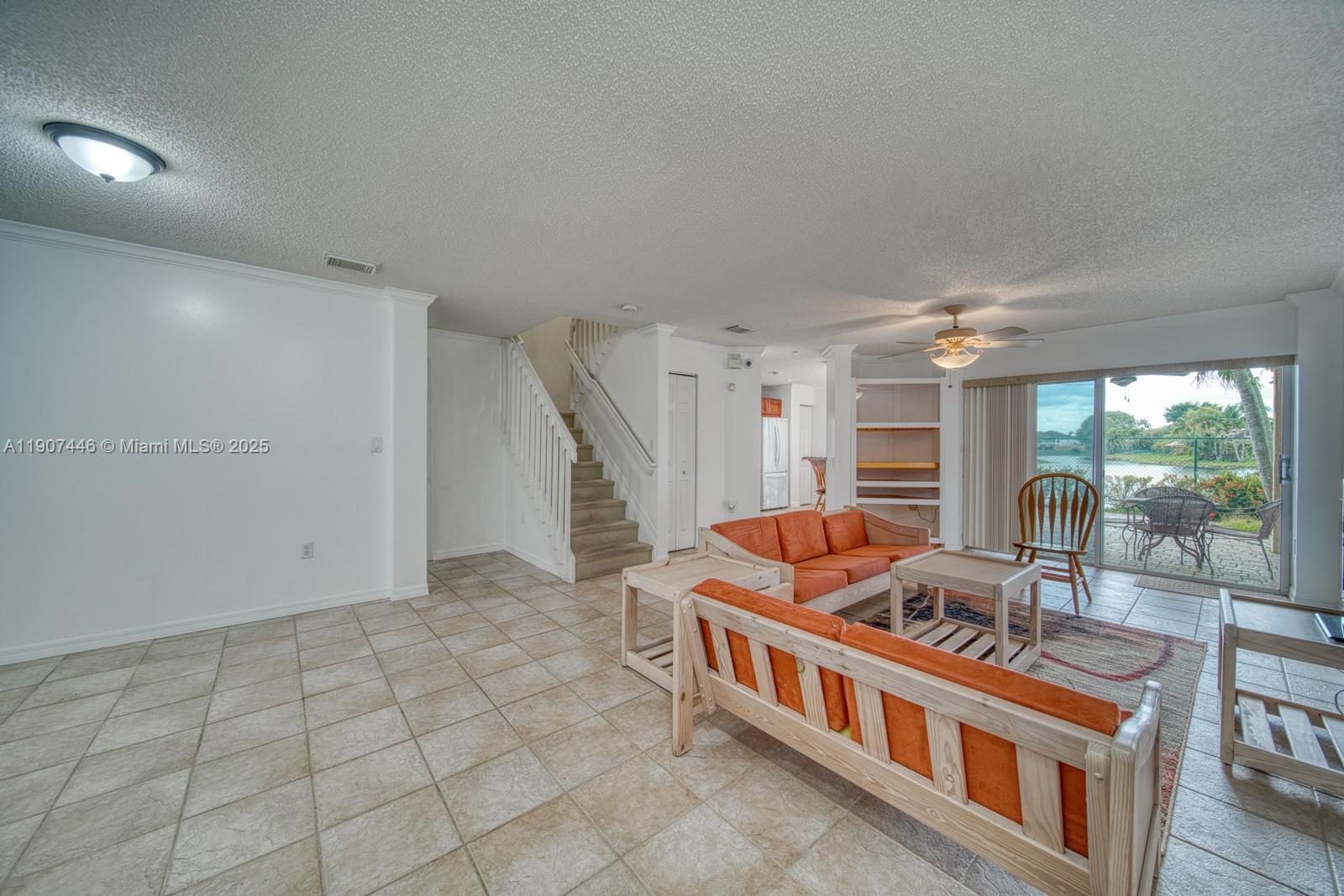 16394 Southwest 75th Street Miami, FL 33193 - Photo 8 of 35 a room with furniture and a table