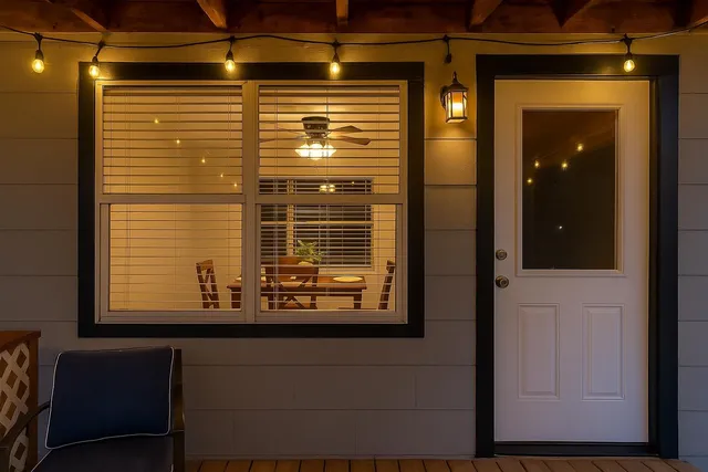 a view of a kitchen with wooden floor and windows