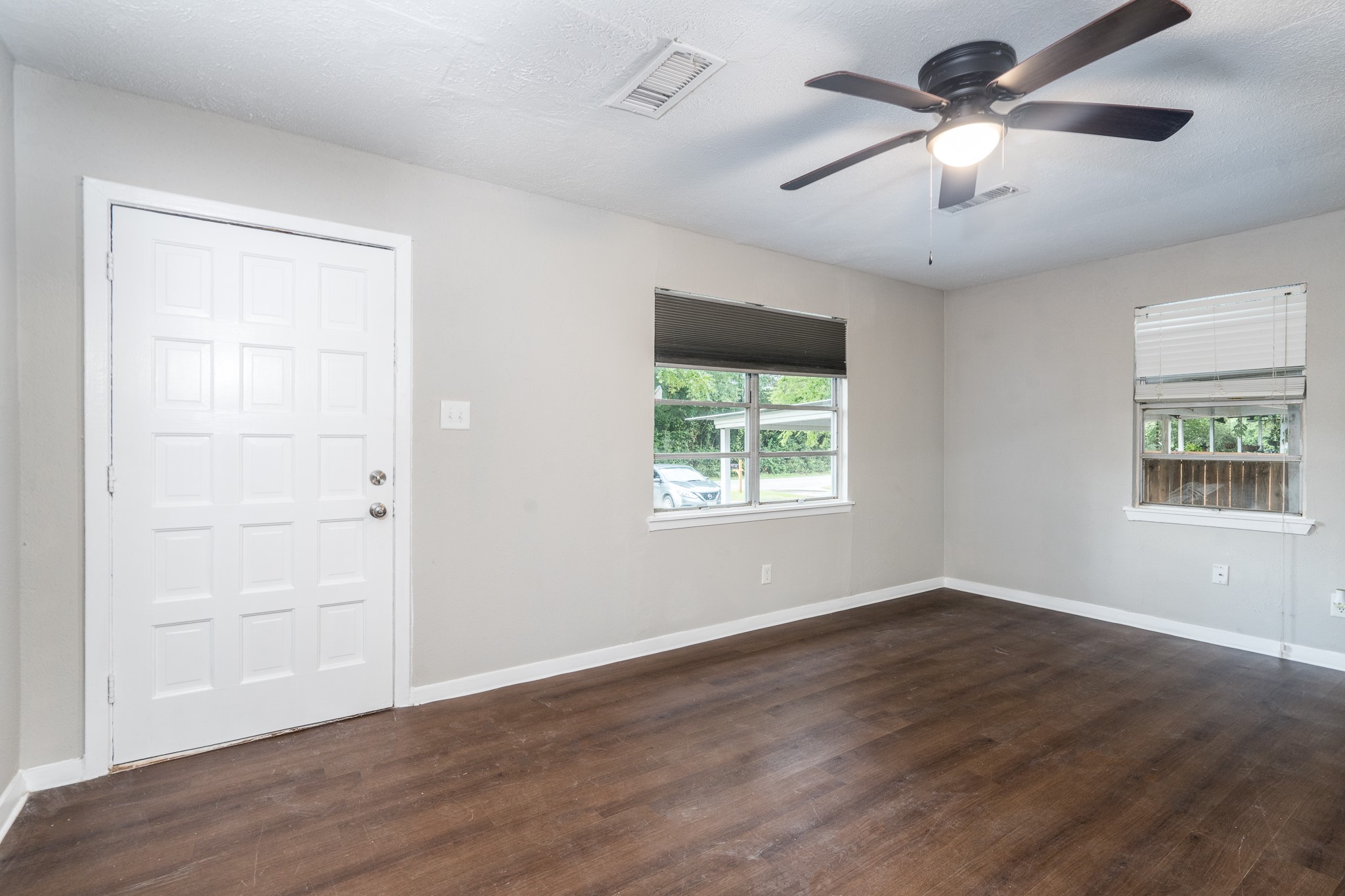 503 Carrell Street Tomball, TX 77375 - Photo 14 of 31 wooden floor in an empty room with a window