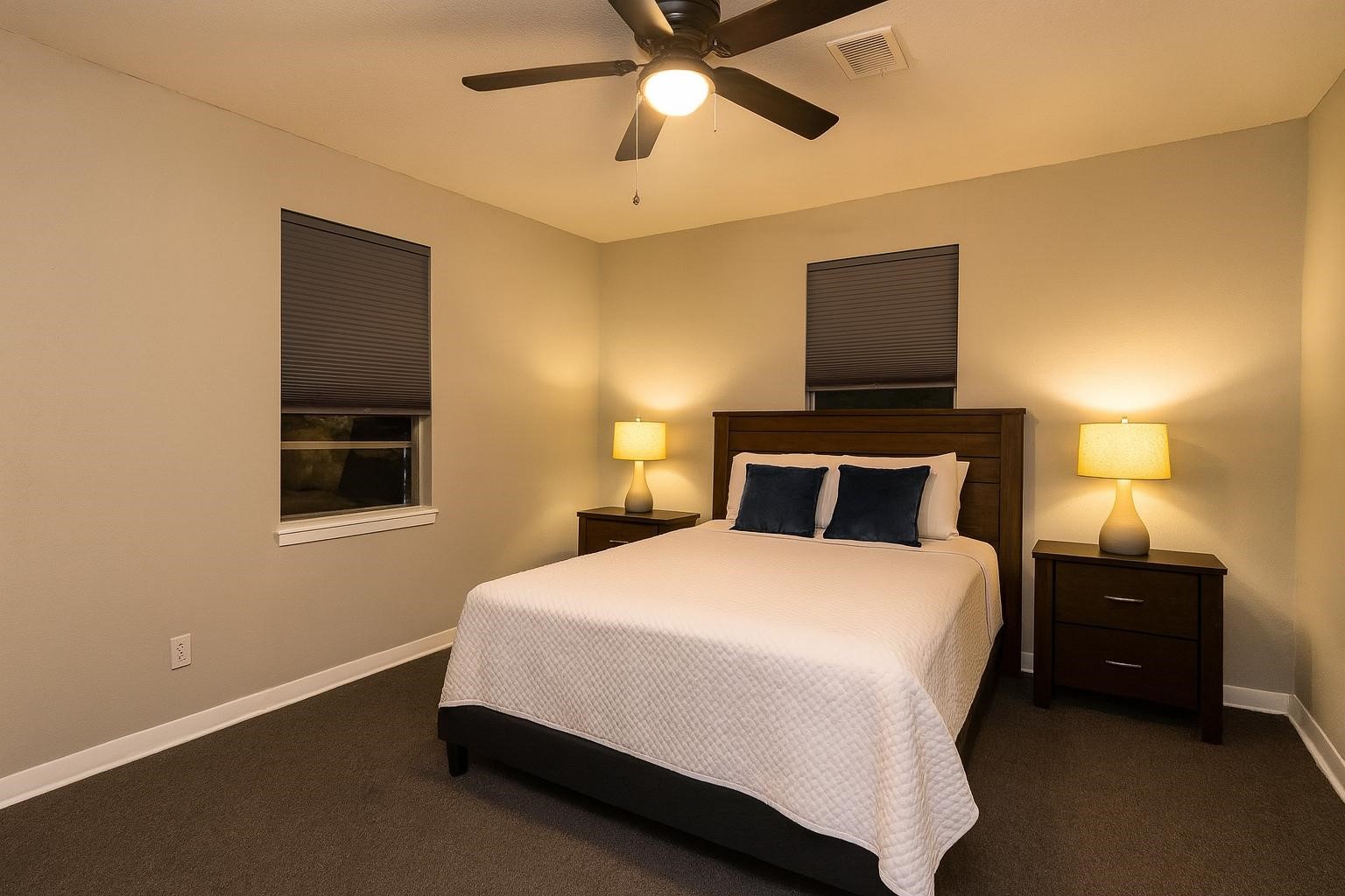 503 Carrell Street Tomball, TX 77375 - Photo 18 of 31 a bedroom with a bed and a lamp on the dresser