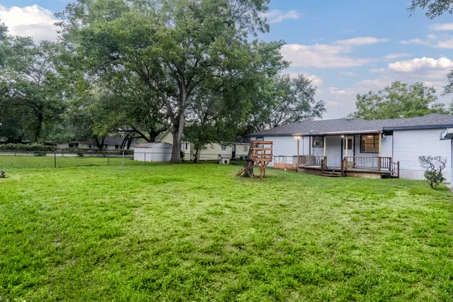 a view of a house with a yard porch and sitting area