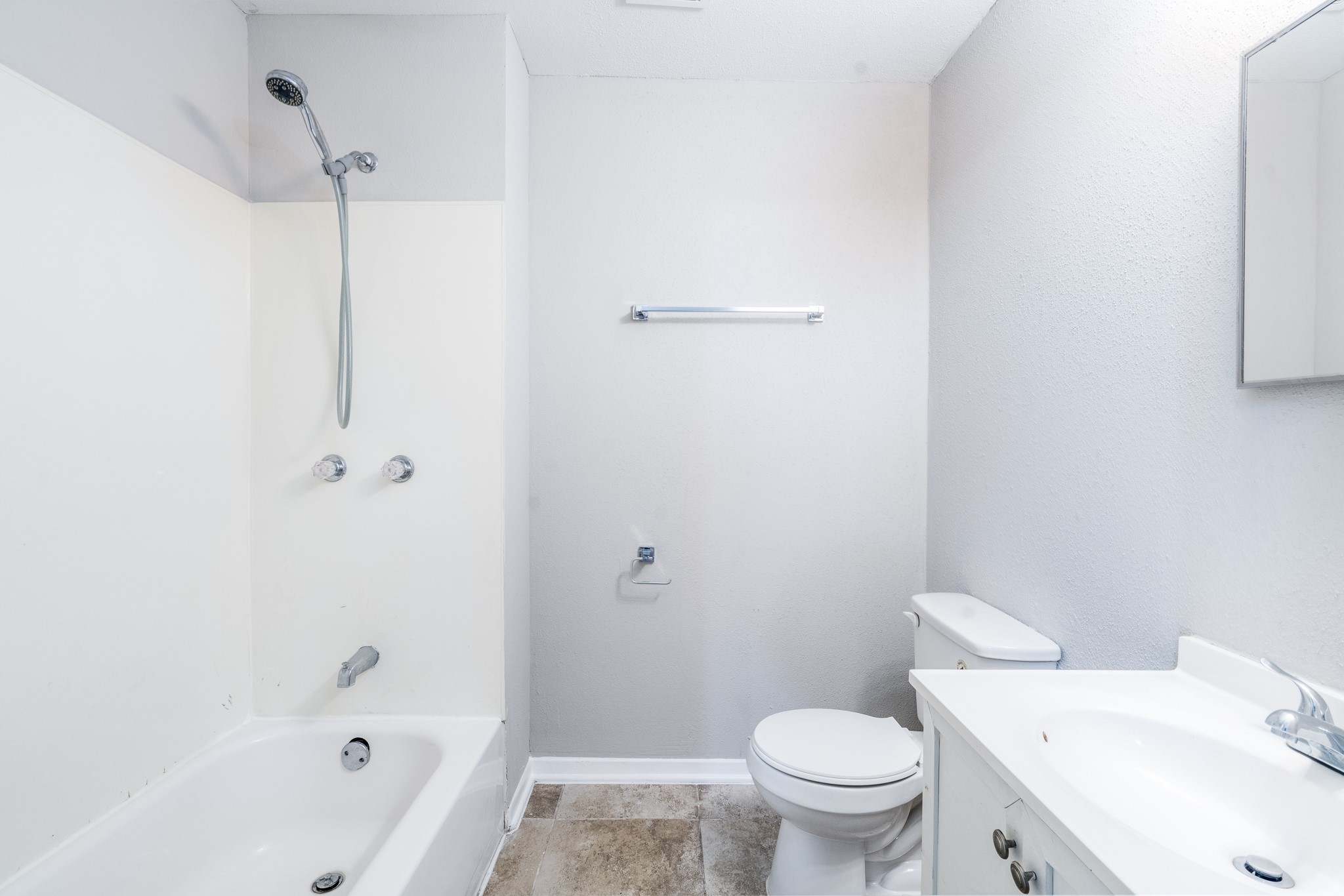 503 Carrell Street Tomball, TX 77375 - Photo 4 of 31 a white toilet sitting next to a bath tub