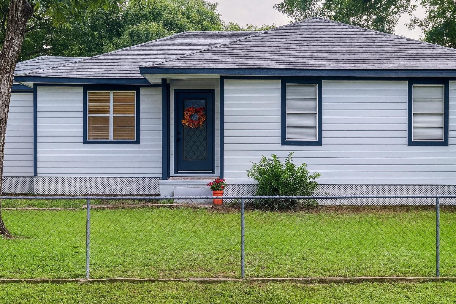 503 Carrell Street Tomball, TX 77375 - Photo 6 of 31 a view of a house with a yard