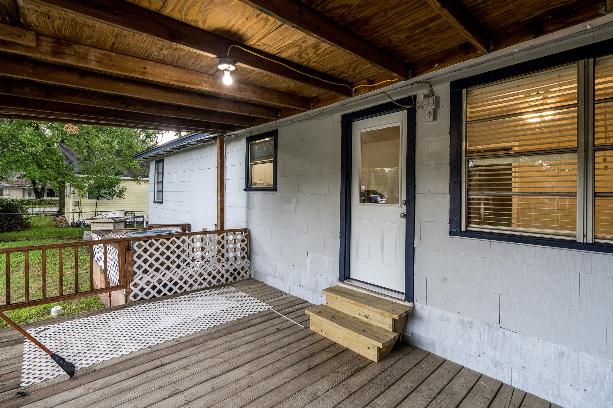 503 Carrell Street Tomball, TX 77375 - Photo 10 of 31 a view of a deck with wooden floor and stairs