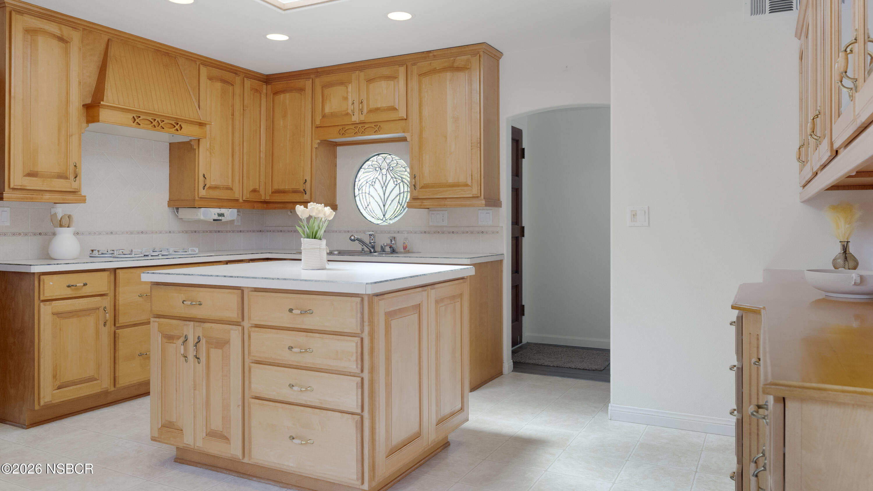 1312 North First Place Lompoc, CA 93436 - Photo 4 of 38 a bathroom with a granite countertop sink and a mirror