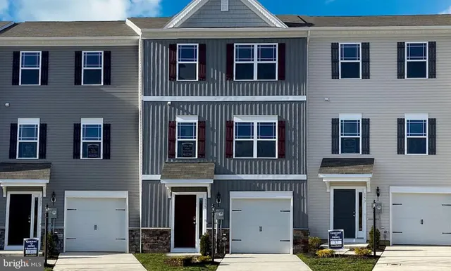 a view of a brick building with many windows