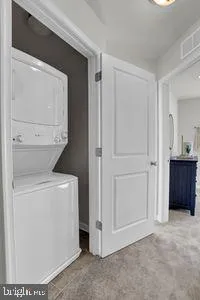 a view of a storage & utility room with washer and dryer