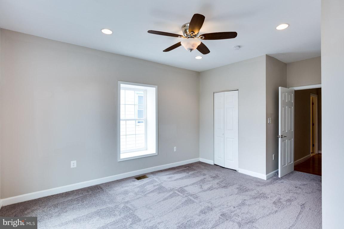 1631 U Street Southeast Washington, DC 20020 - Photo 23 of 24 a view of a livingroom with a ceiling fan and window