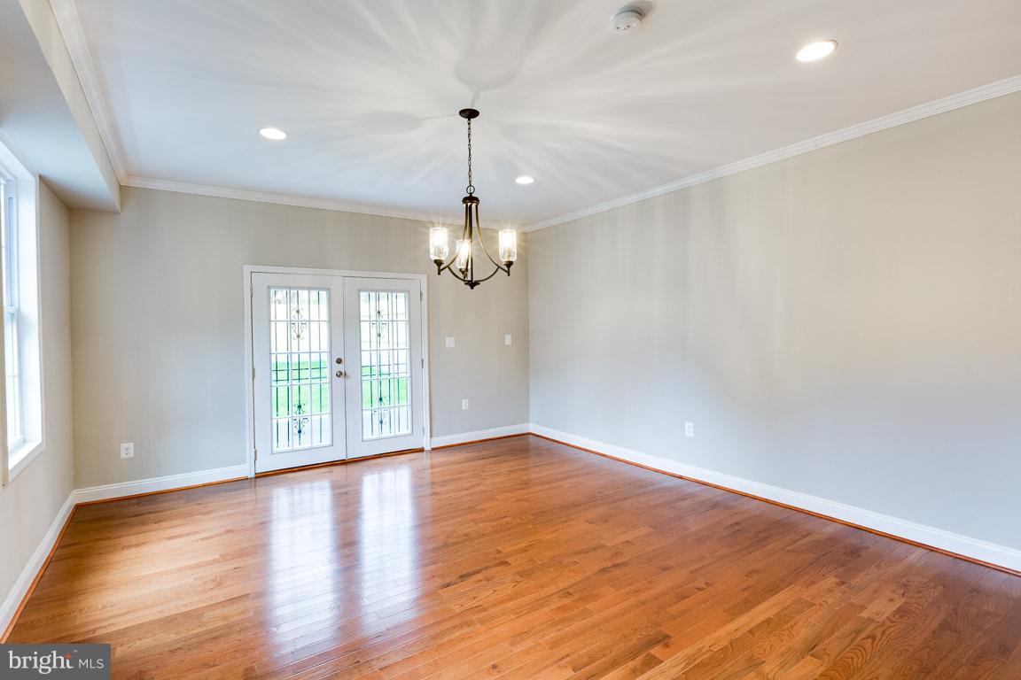 1631 U Street Southeast Washington, DC 20020 - Photo 6 of 24 wooden floor in an empty room with a window