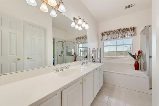 a bathroom with a sink a vanity and a mirror