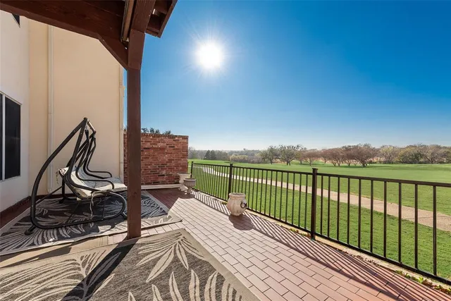 a view of balcony with wooden floor