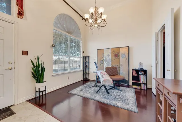 a view of a livingroom with furniture window and wooden floor