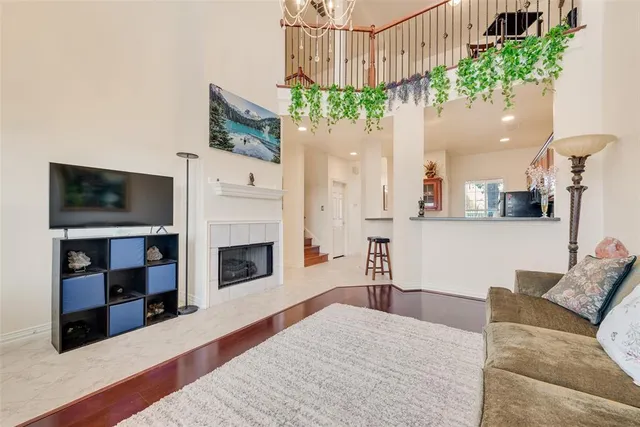 a living room with furniture fireplace and flat screen tv
