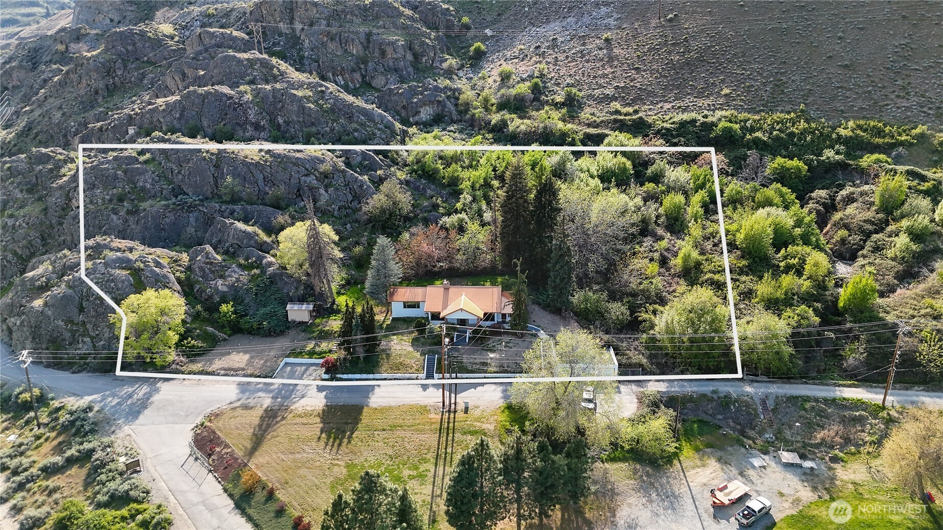 15 Beebe Fish Hatchery Road Chelan, WA 98816 - Photo 2 of 40 an aerial view of a house with swimming pool outdoor seating and yard