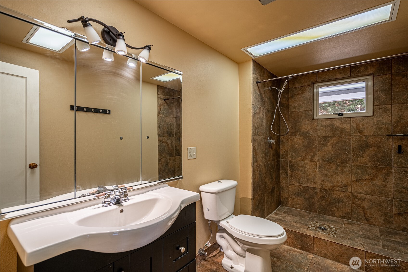 15 Beebe Fish Hatchery Road Chelan, WA 98816 - Photo 27 of 40 a bathroom with a sink toilet and shower