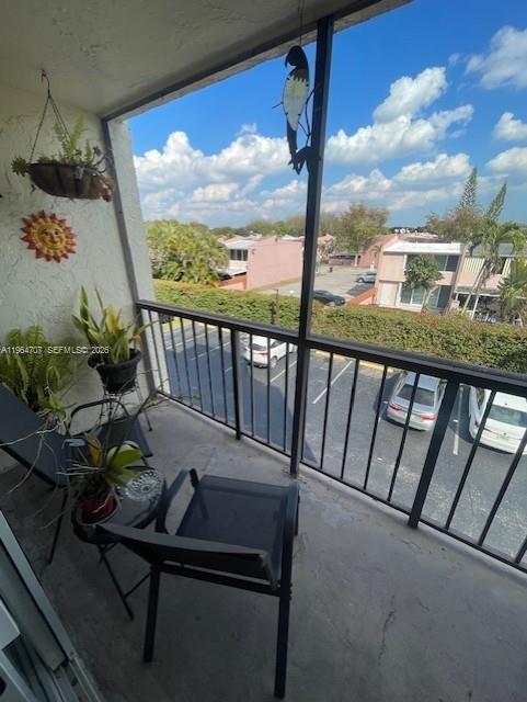 14250 Southwest 62nd Street, Unit 320 Miami, FL 33183 - Photo 14 of 14 a view of a balcony with furniture