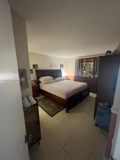 14250 Southwest 62nd Street, Unit 320 Miami, FL 33183 - Photo 5 of 14 a bedroom with a bed and a couch