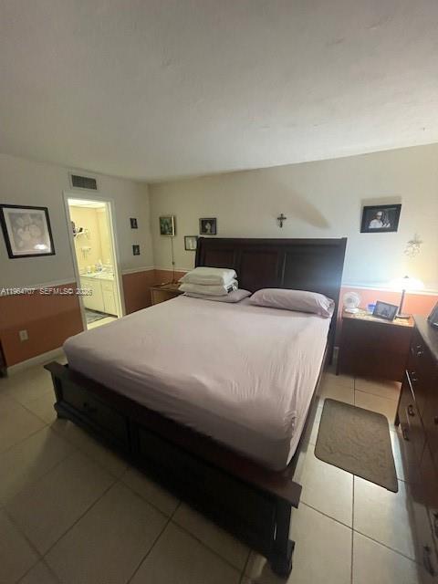 14250 Southwest 62nd Street, Unit 320 Miami, FL 33183 - Photo 6 of 14 a bedroom with a bed and a lamp