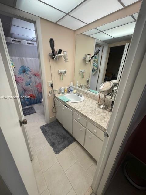 14250 Southwest 62nd Street, Unit 320 Miami, FL 33183 - Photo 7 of 14 a bathroom with a sink a toilet and shower