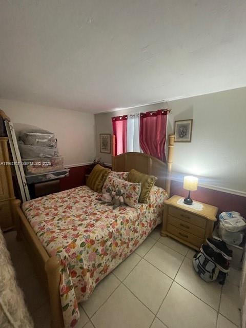 14250 Southwest 62nd Street, Unit 320 Miami, FL 33183 - Photo 10 of 14 a bedroom with a bed and dresser