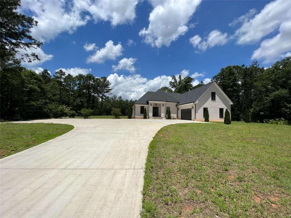 613 Bill Rutledge Road Winder, GA 30680 - Photo 1 of 1 a front view of a house with garden