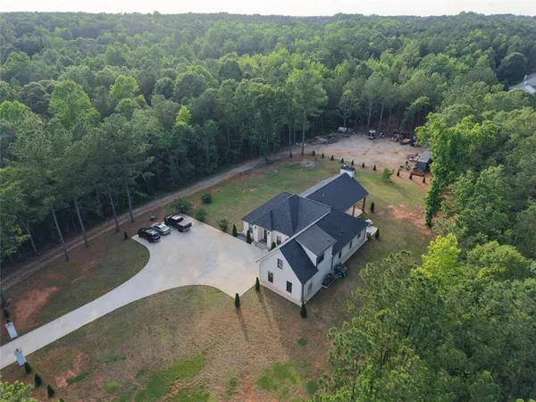 a view of house with outdoor space and car parked