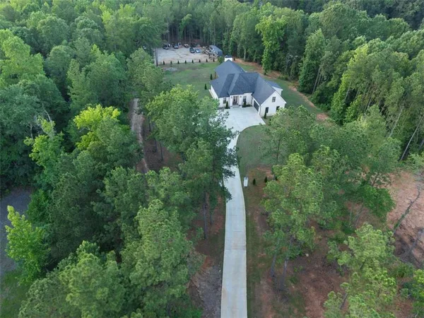 a view of a house with a backyard