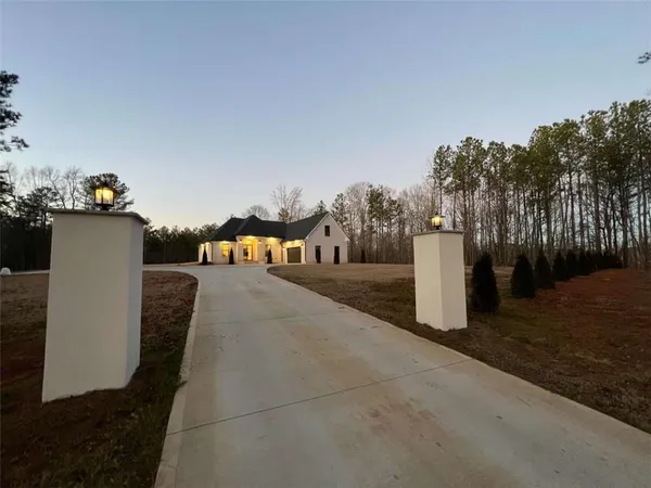 an aerial view of a house with outdoor space