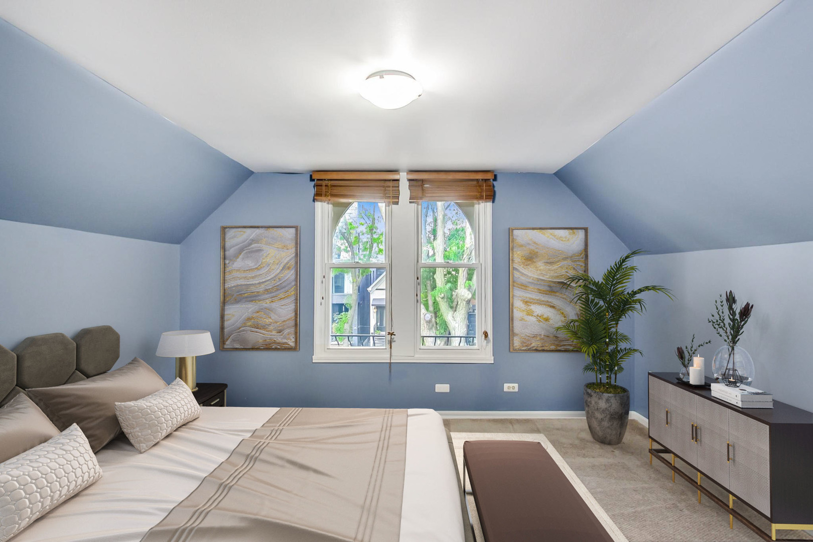 2035 West Rice Street Chicago, IL 60622 - Photo 11 of 27 a bedroom with a large bed and a potted plant