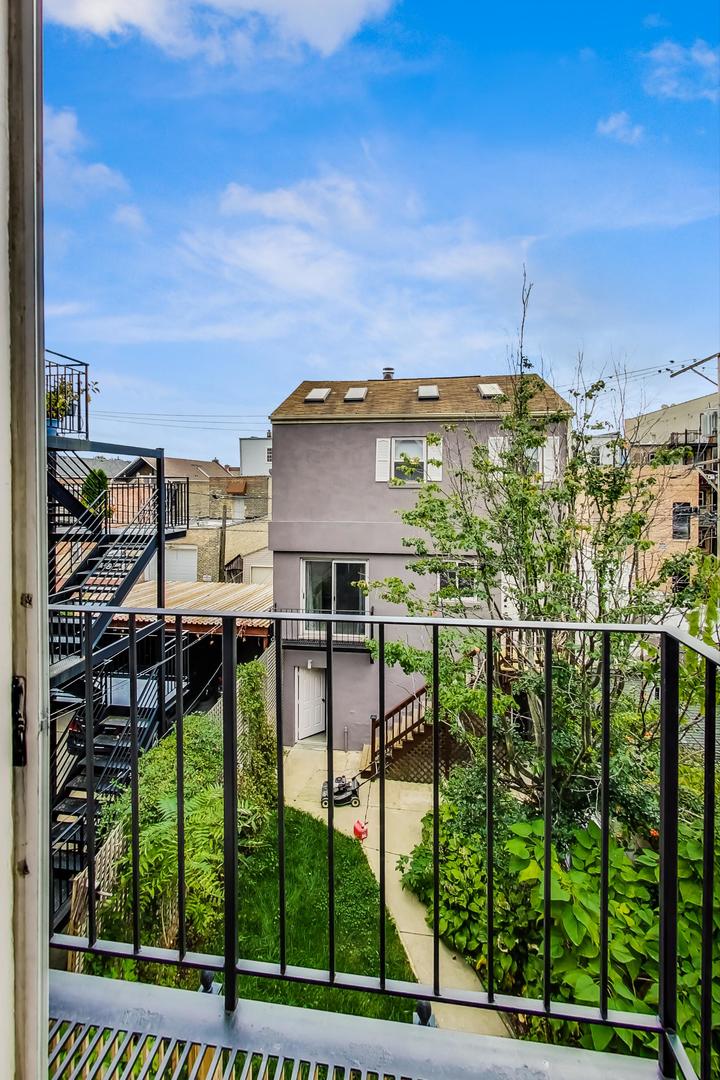 2035 West Rice Street Chicago, IL 60622 - Photo 15 of 27 a view of a city from a balcony