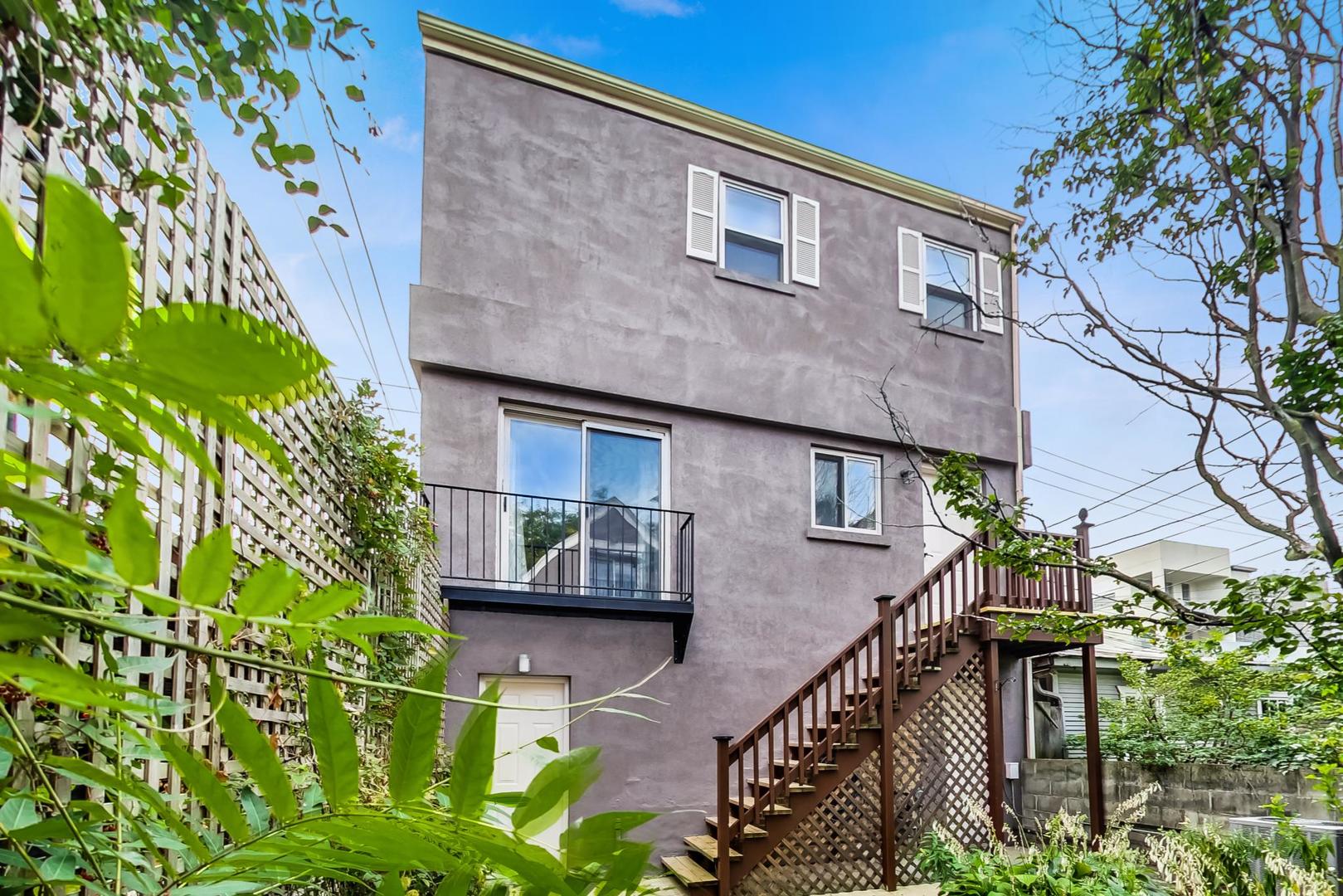 2035 West Rice Street Chicago, IL 60622 - Photo 18 of 27 a front view of a house with a garden