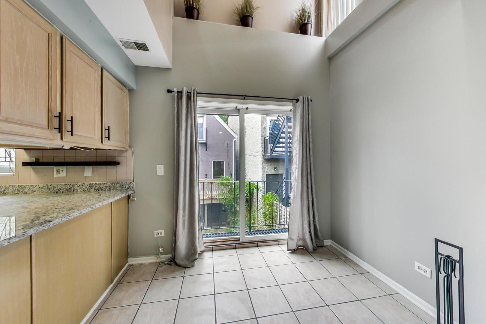 2035 West Rice Street Chicago, IL 60622 - Photo 21 of 27 a view of kitchen with granite countertop cabinets
