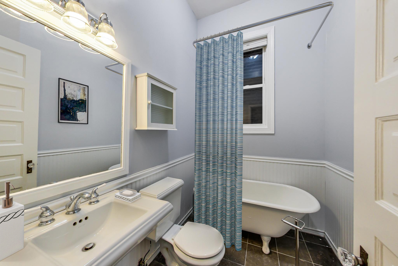 2035 West Rice Street Chicago, IL 60622 - Photo 7 of 27 a bathroom with a sink mirror and toilet
