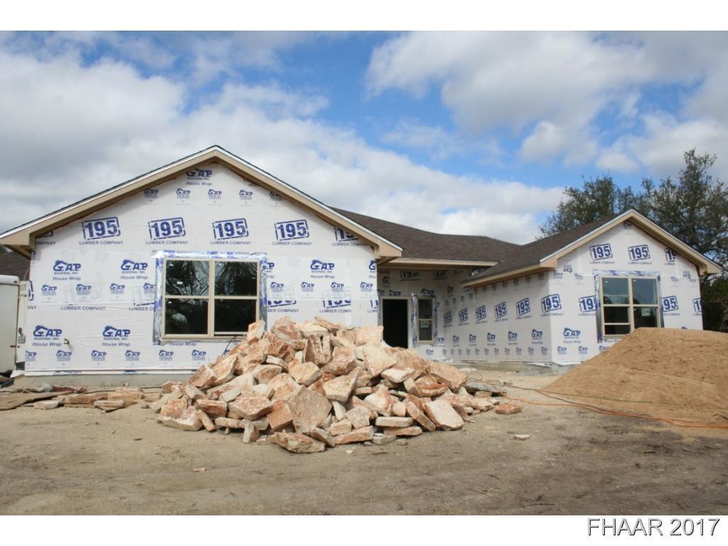 a view of house with yard