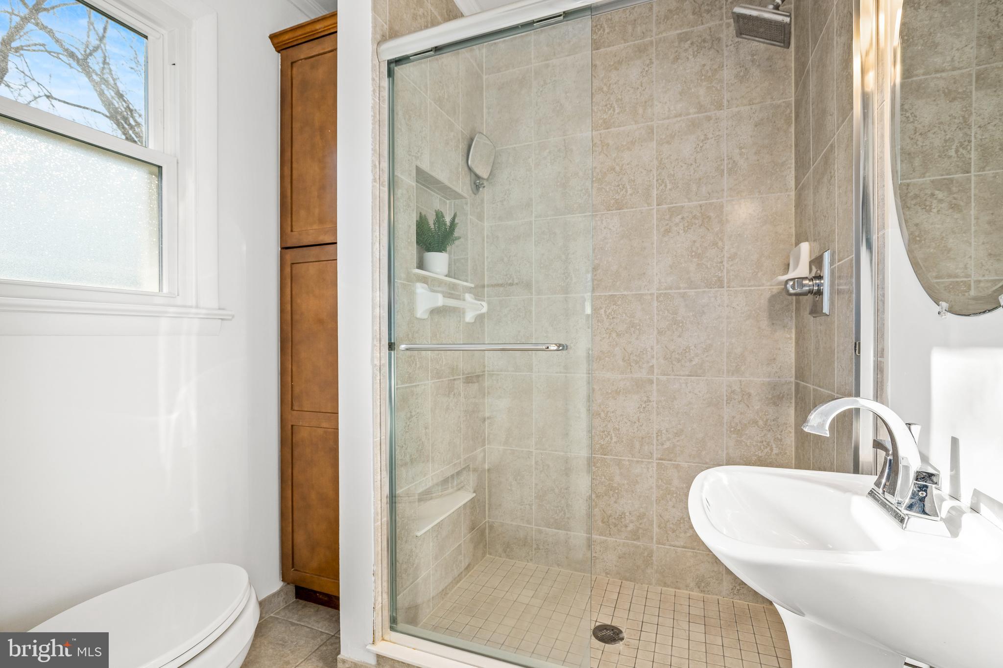 2700 Spencer Road Chevy Chase, MD 20815 - Photo 19 of 40 a bathroom with a sink and a mirror