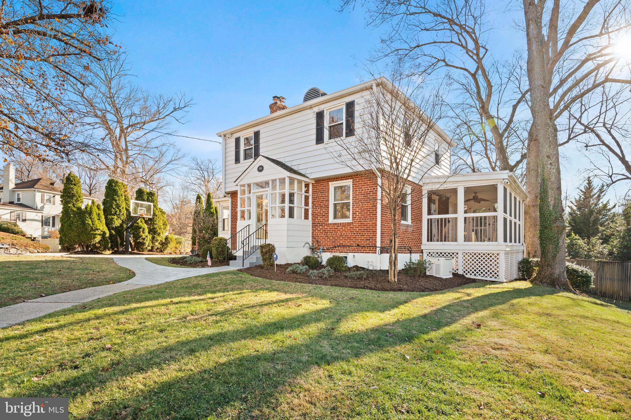 2700 Spencer Road Chevy Chase, MD 20815 - Photo 2 of 40 a front view of a house with a yard