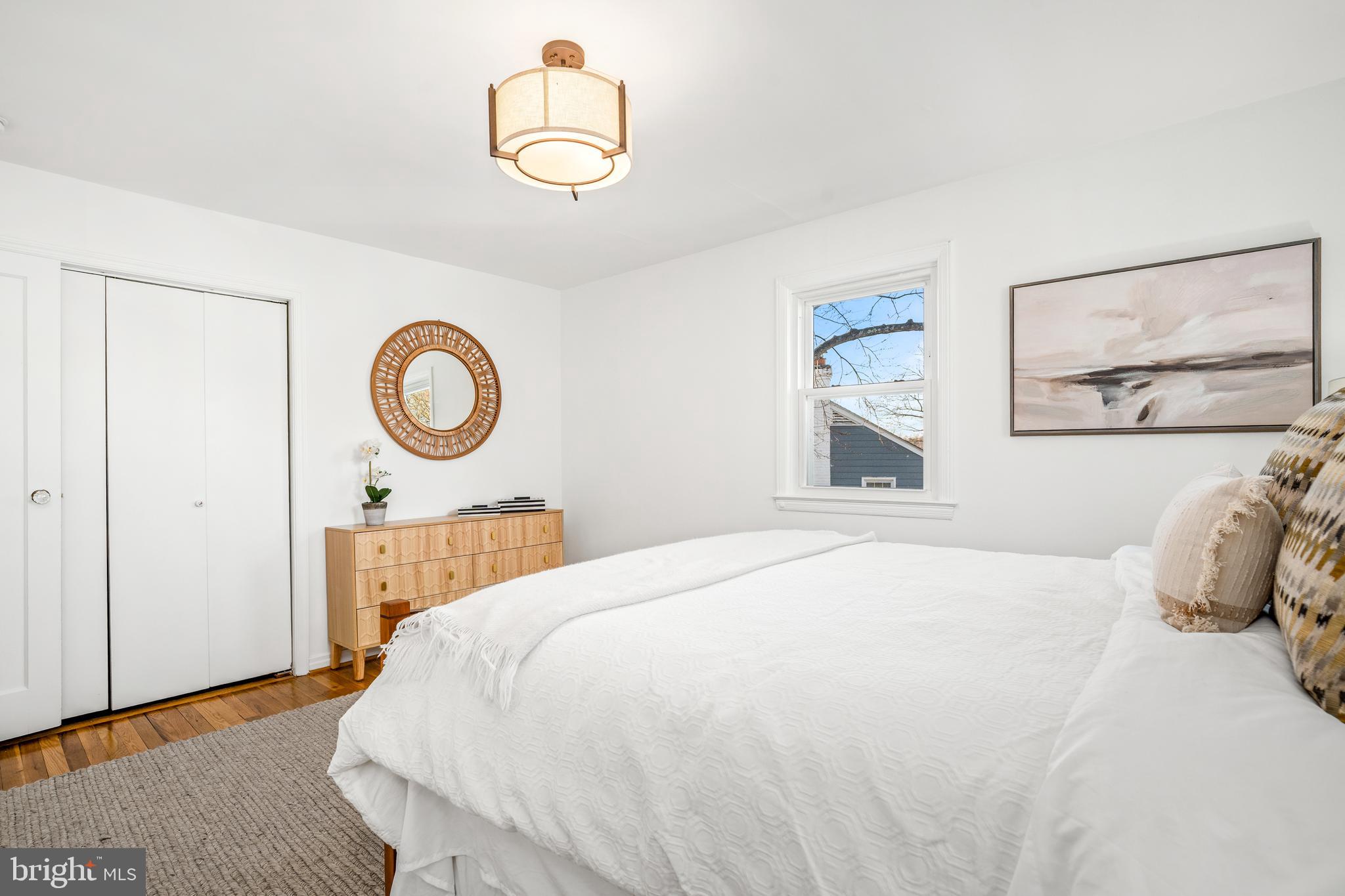 2700 Spencer Road Chevy Chase, MD 20815 - Photo 24 of 40 a bedroom with a bed and a chandelier