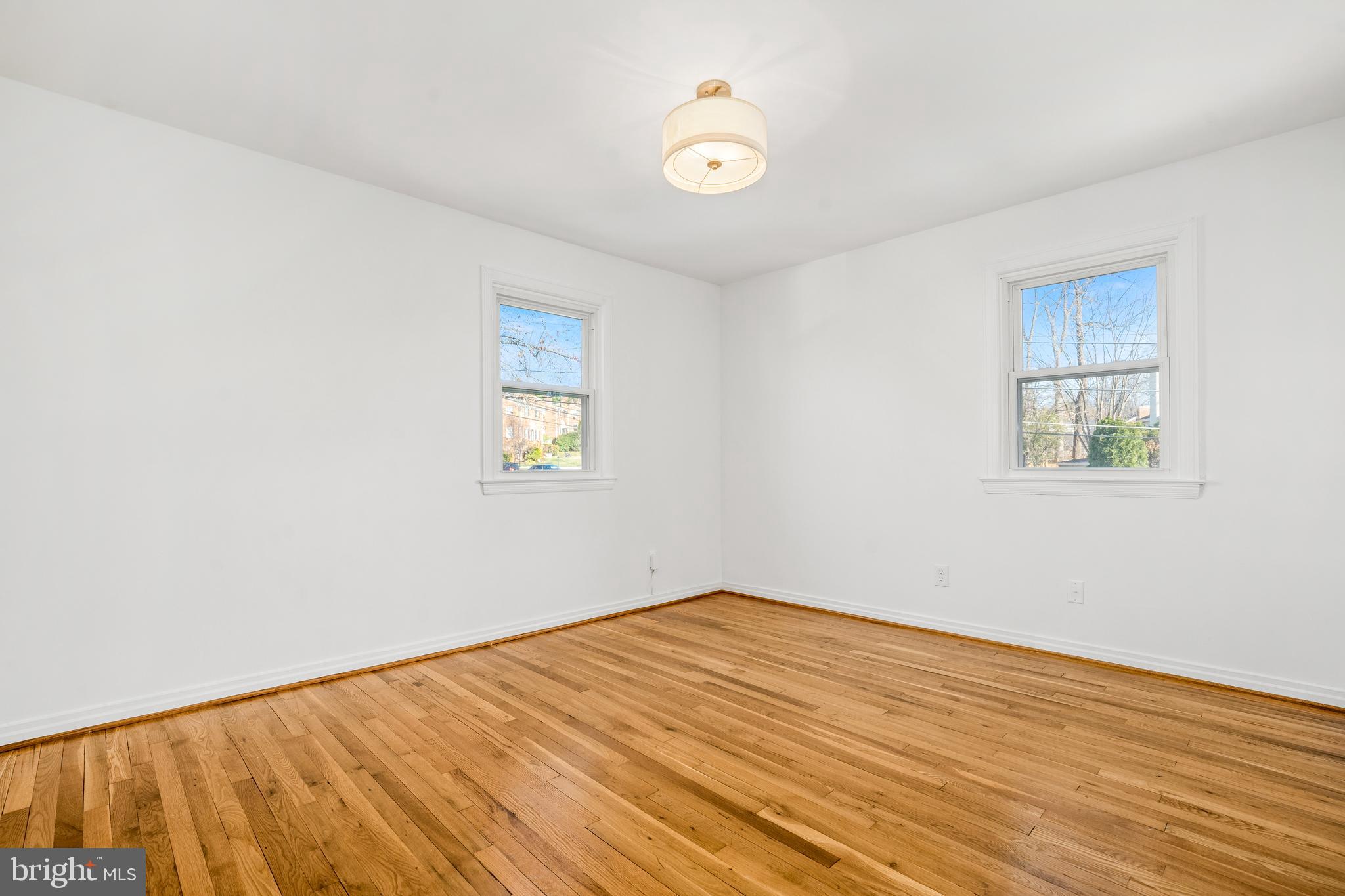 2700 Spencer Road Chevy Chase, MD 20815 - Photo 27 of 40 an empty room with a window