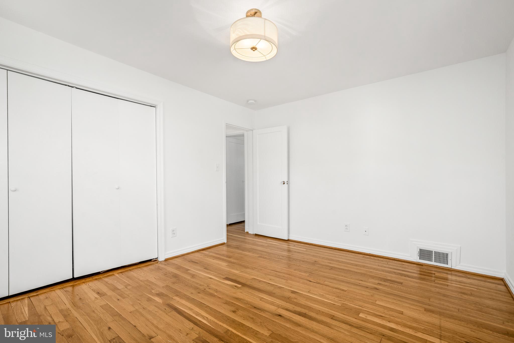 2700 Spencer Road Chevy Chase, MD 20815 - Photo 28 of 40 a view of a room with wooden floor