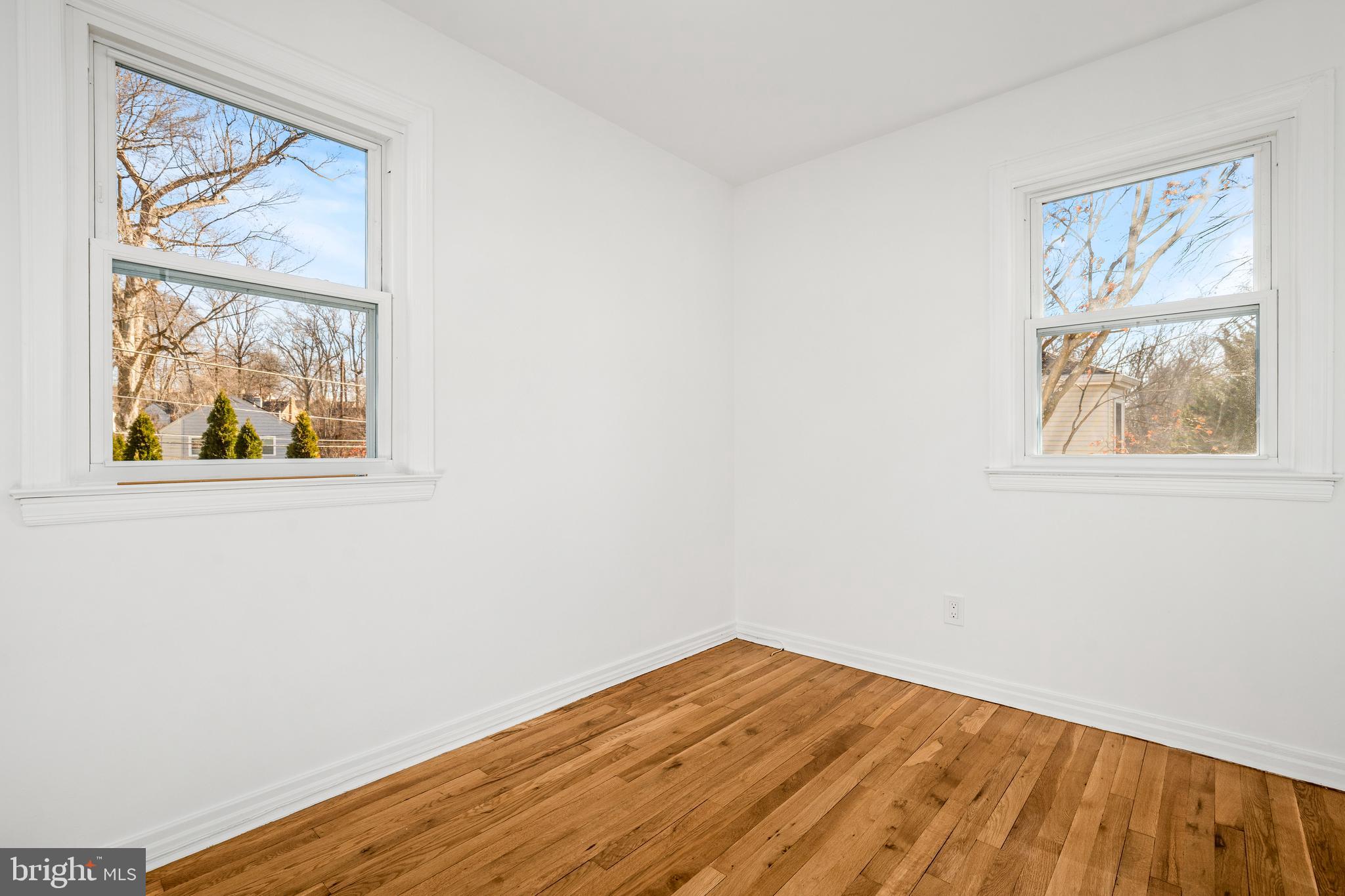 2700 Spencer Road Chevy Chase, MD 20815 - Photo 29 of 40 a view of room with window and wooden floor